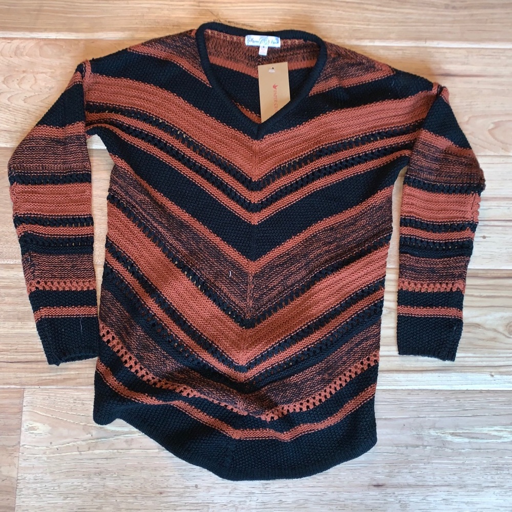 An orange and black “hipster” sweatshirt
